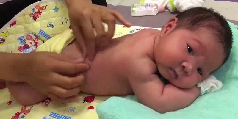 Use your palms and fingers to gently massage the baby.