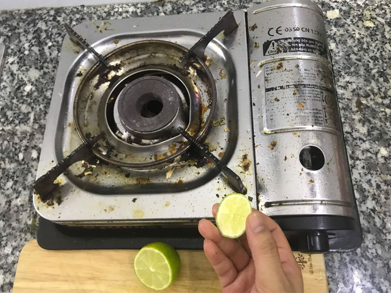 Clean shiny, clean gas stove with 3 ingredients right at the kitchen