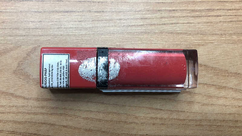 Glue sticks on lipstick after removing the stamp